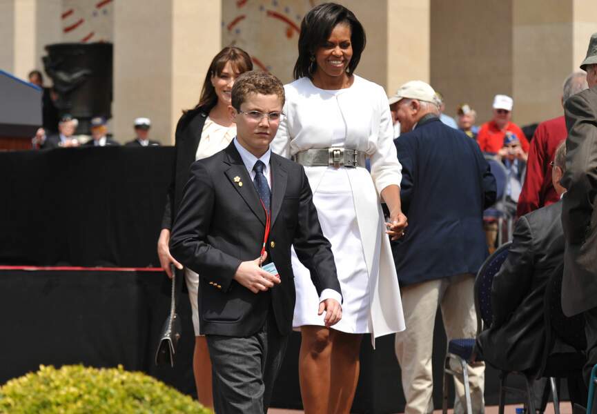 En 2009, avec Michelle Obama, lors du 65e anniversaire du débarquement de Normandie