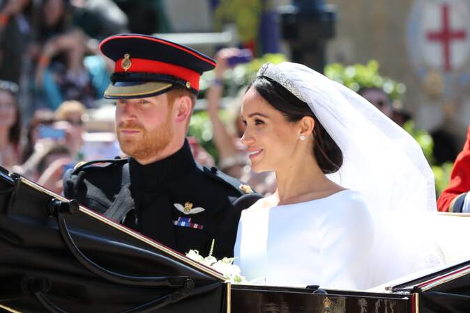 Harry et Meghan Markle en calèche à la sortie du château de Windsor après leur mariage le 19 mai 2018