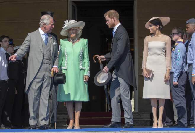 Camilla, Harry et Meghan lors de la garden party pour les 70 ans du prince Charles, le 22 mai 2018
