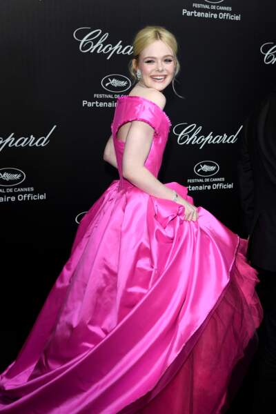 Elle Fanning en robe rose Vivienne Westwood, au diner "Love Night" de Chopard, le 17 mai 2019