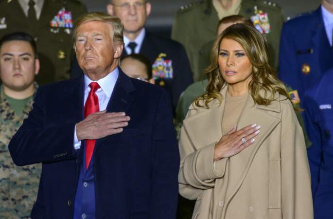 Melania et Donald Trump pendant l'hymne national américain dans le Maryand, le 20 décembre 2019