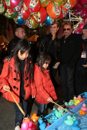 Johnny Hallyday, Laeticia et leurs filles Jade et Joy a la soirée d'inauguration de "Jours de Fetes" au Grand Palais a Paris, le 19 decembre 2013.