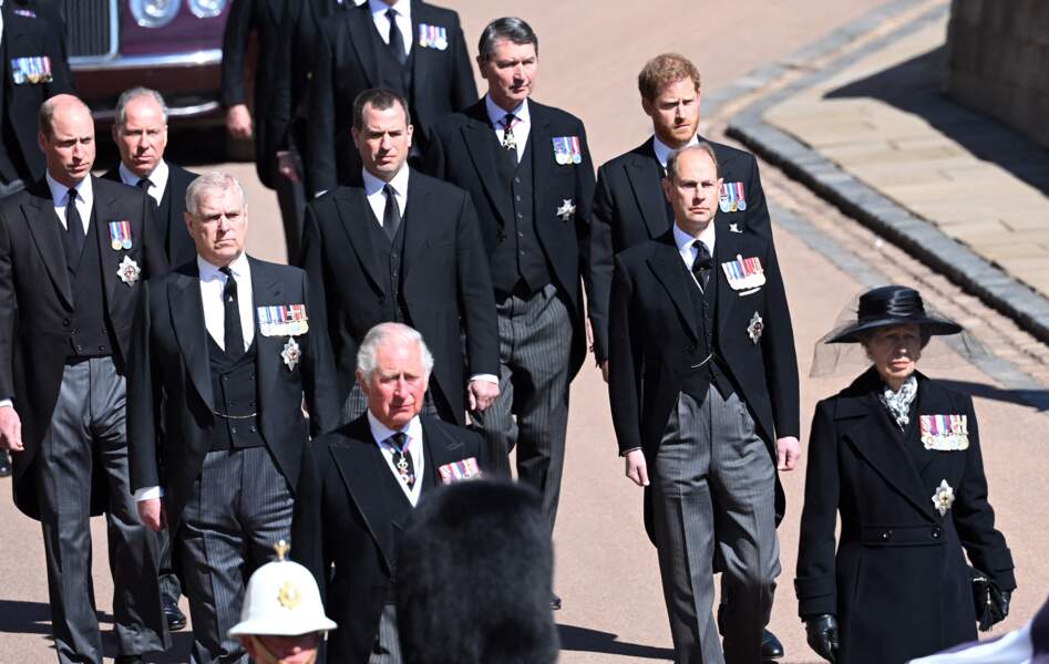 Prince Harry stripped of his military titles is placed opposite his brother in the procession of St. George's Chapel.