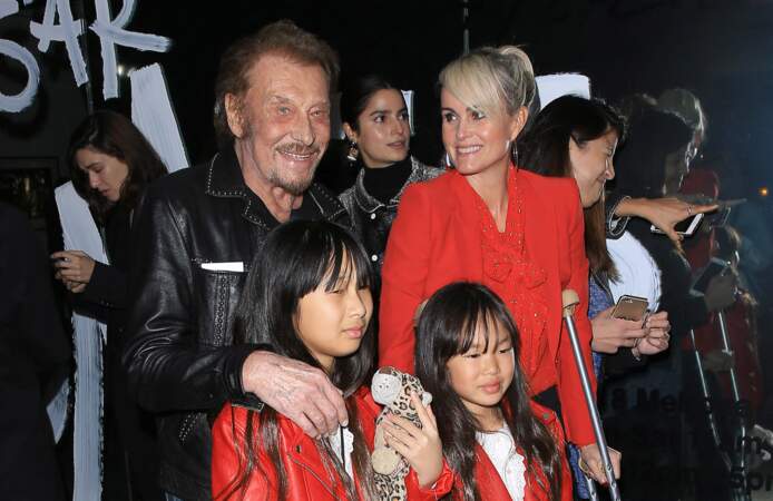 Johnny Hallyday, sa femme Laeticia  et leurs filles Jade et Joy au vernissage de l'exposition du photographe Mathieu Cesar à Los Angeles. Le 21 février 2017
