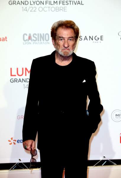 Eddy Mitchell apparaît sur le tapis rouge de la cérémonie d'ouverture du Festival Lumière où il est honoré, à Lyon le 14 octobre 2017.