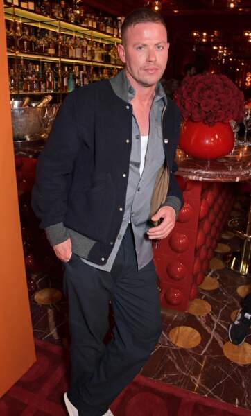 Michael Hennegan dans son look casual-sportwear à la soirée de lancement de la collaboration Michael Kors X Ellesse, à Londres. Le 4 mai 2022.