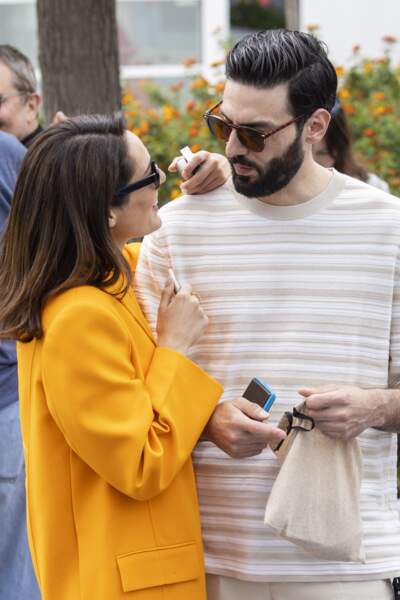 Sofia Essaïdi resplendissante aux côtés de son compagnon Adrien Galo avant de participer au photocall du  film "Nostalgia" lors du 75ème Festival International du Film de Cannes, le 25 mai 2022.