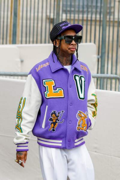 Le rappeur américain Tyga en veste high school et tendance de la marque Louis Vuitton, ce 23 juin 2022.