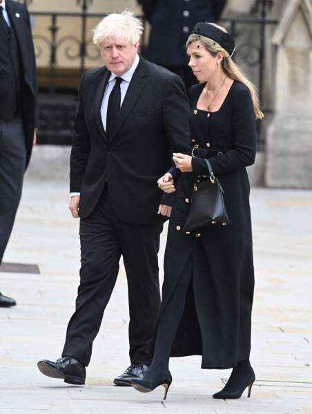 L'ancien Premier ministre Boris Johnson et son épouse Carrie Symonds arrivent dans l'Abbaye de Westminster pour assister aux funérailles d'Elizabeth II, le 19 septembre 2022.