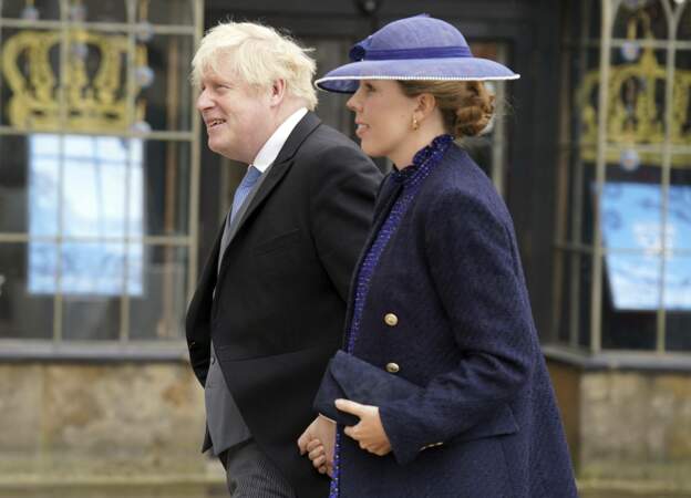 Boris Johnson et son épouse Carrie Symonds, à leur arrivée à la cérémonie de couronnement du roi Charles III, à l'abbaye de Westminster, à Londres,  le 6 mai 2023. 
