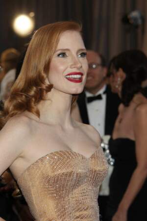 Les boucles blond vénitien effet glossy de Jessica Chastain aux Oscars 2013