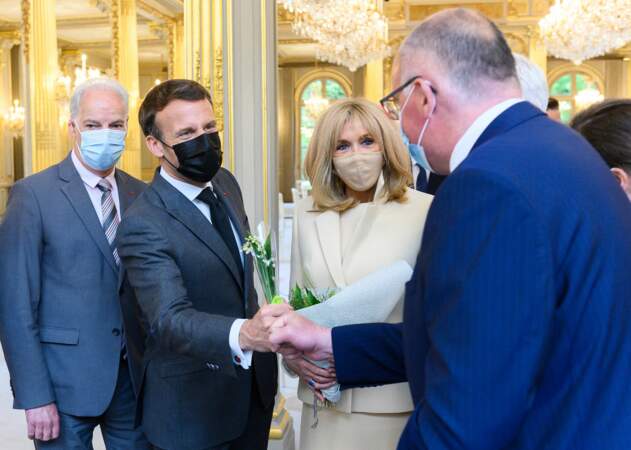 Emmanuel et Brigitte Macron lors d'une cérémonie du 1er mai en petit comité.