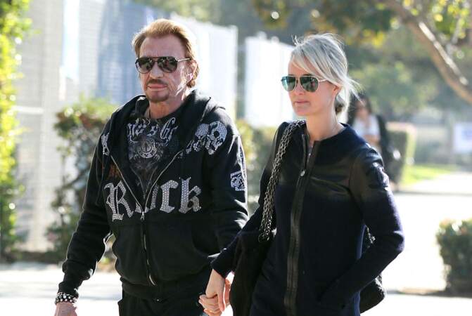 Johnny et Laeticia Hallyday en pleine séance shopping avec leurs filles Jade et Joy, à Los Angeles, le 14 février 2013.