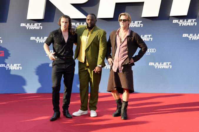 Aaron Taylor Johnson, Brian Tyree Henry et Brad Pitt à la première du film "Bullet Train", à Berlin, le 19 juillet 2022.
