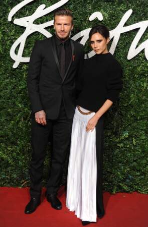 Victoria et David Beckham pose l'un à côté de l'autre à la cérémonie "The British Fashion Awards" à Londres en 2014